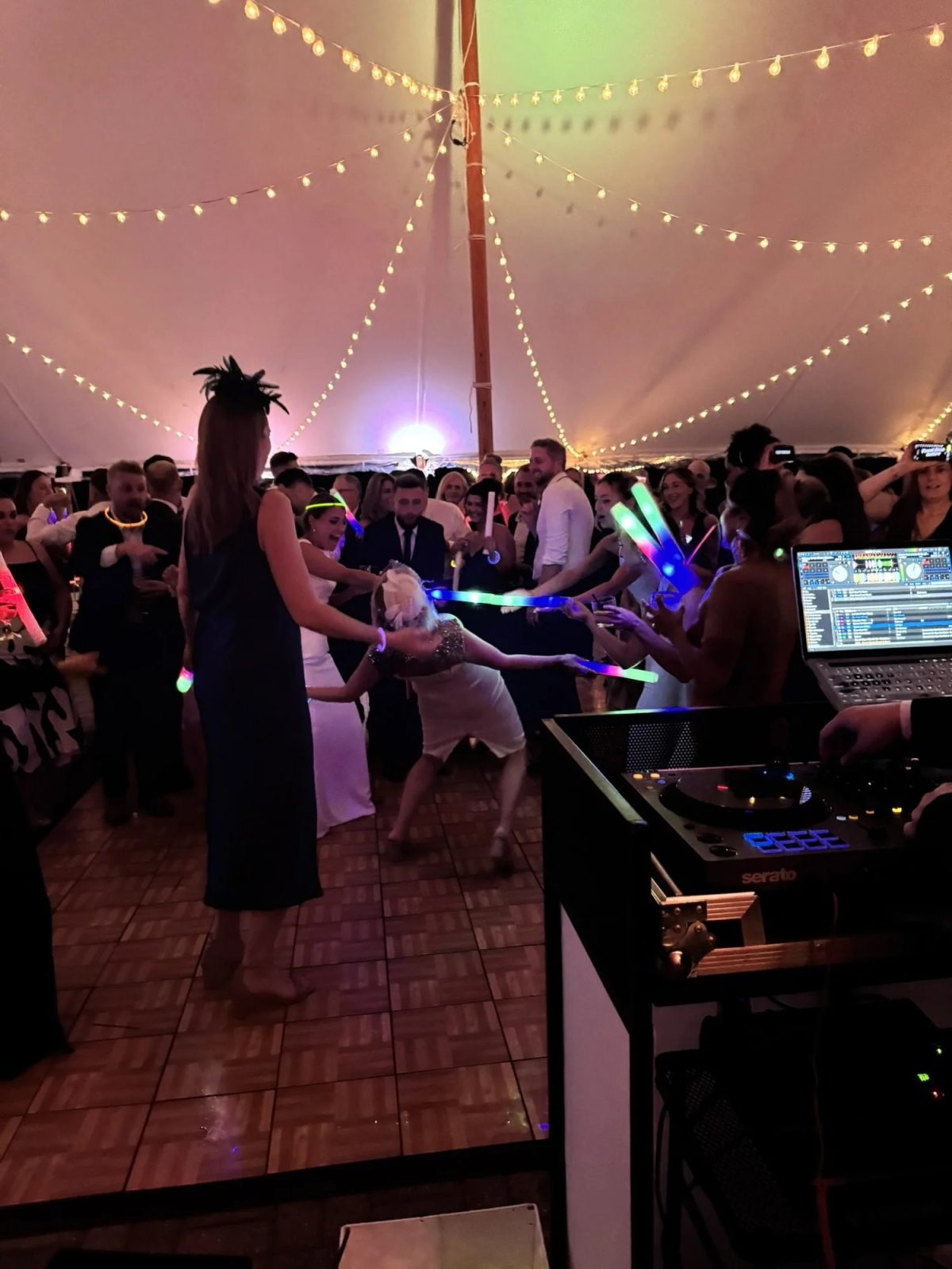 DJ Sneek lighting up a tented reception