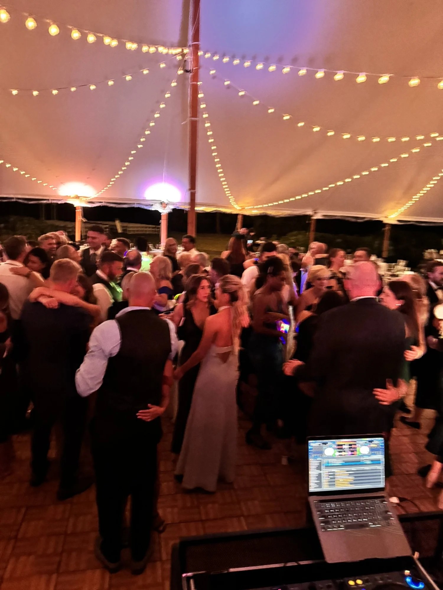 Tented reception under string lights